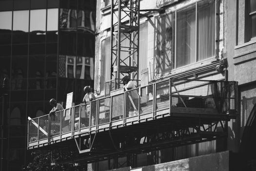 Suspended Working Platform selection criteria - Suspension Rig: Counterweighted Parapet vs Roof Trolley vs Davit