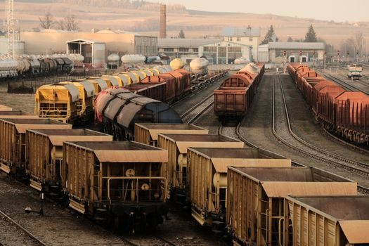 Overhead Conveyor selection for chemical shipping - Track type and corrosion class — enclosed track vs. I-beam vs. monorail
