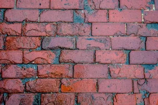 Fired Clay Brick selection for commercial buildings - Climate, mortar, and the maintenance trap