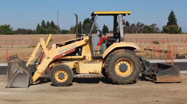 Backhoe Loader vs Asphalt Paver - Where an Asphalt Paver Owns the Job