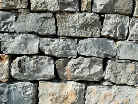 Building Stone selection for cold storage warehouses - Where stone still earns a place: aprons, plinths, vestibules, and exterior cladd