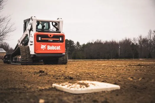 Excavator installation guide - Track installation: ground prep, drive-wheel bolt-up, and tensioning